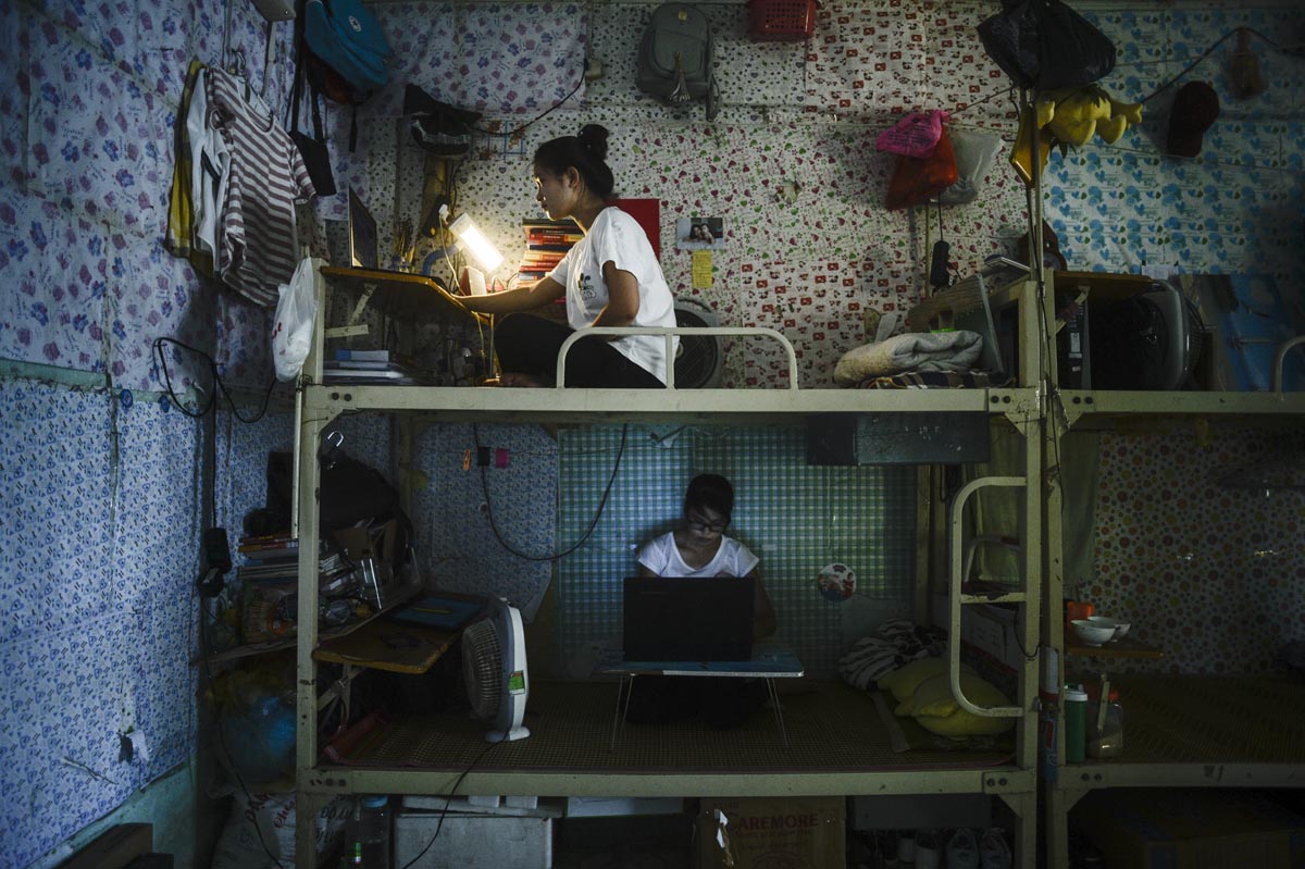 Two woman studying in a destitute room