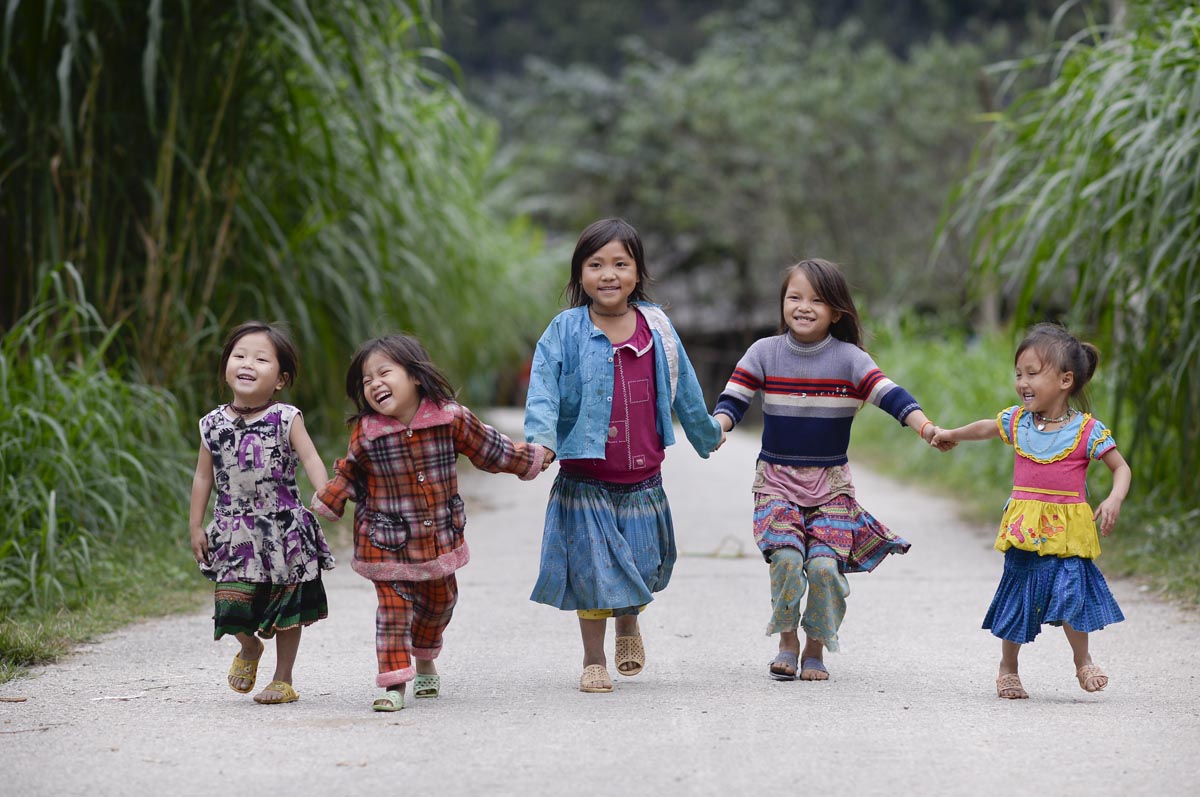 Young children holding hands