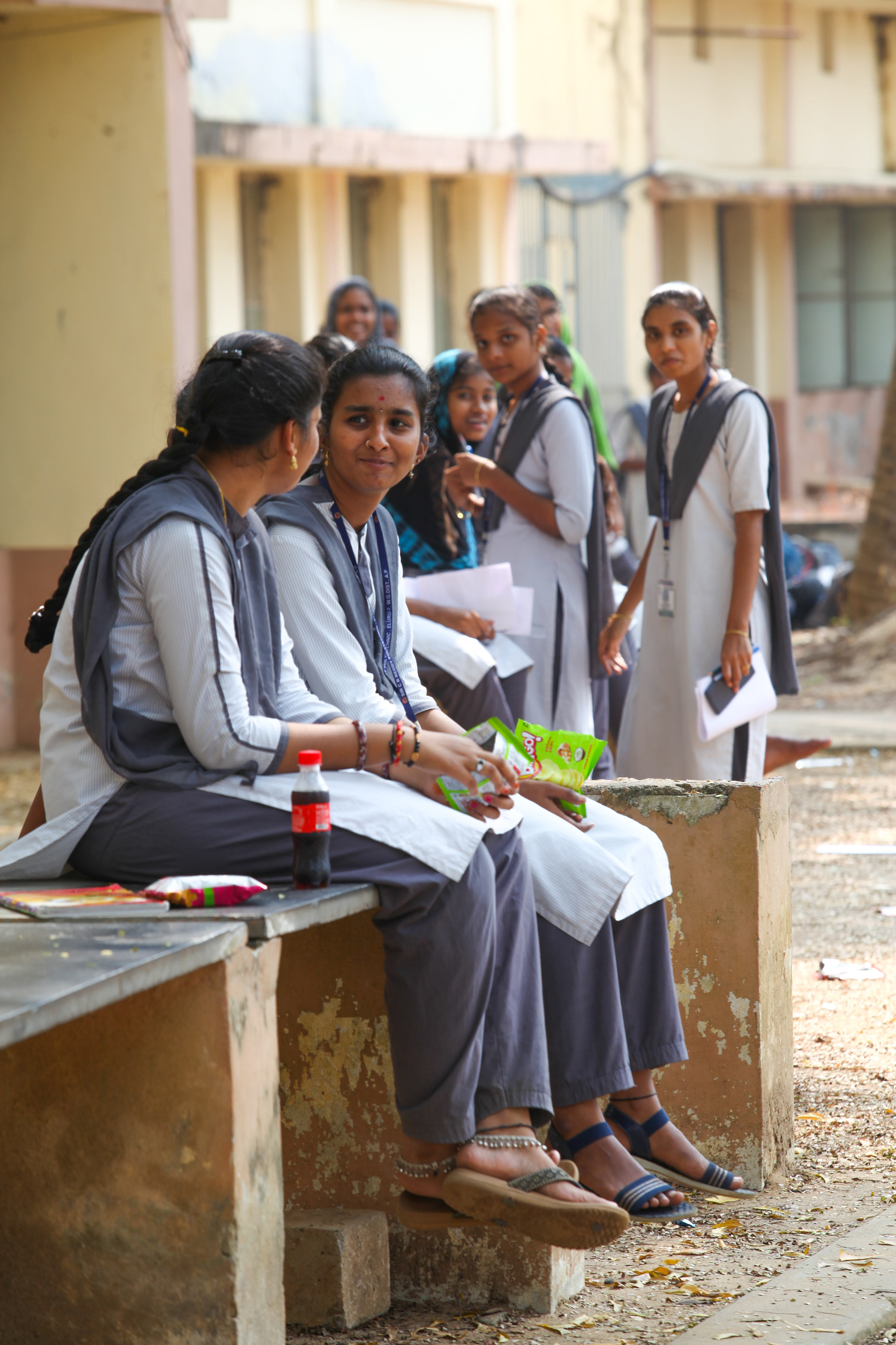 Two students chatting outside of school