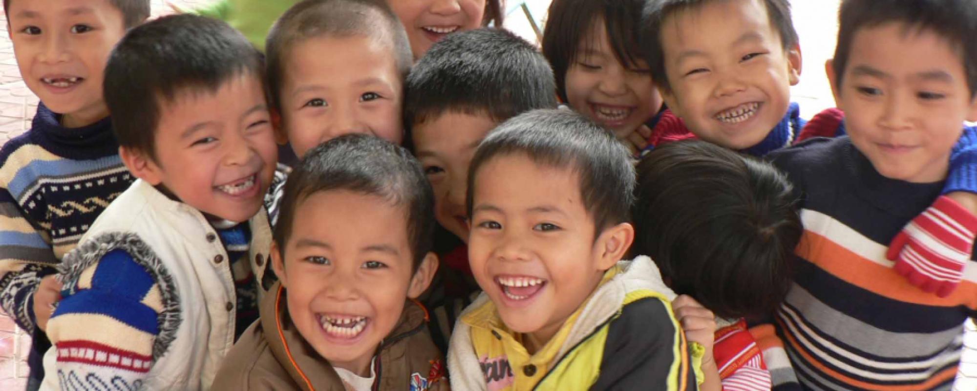 group of small boys smiling 
