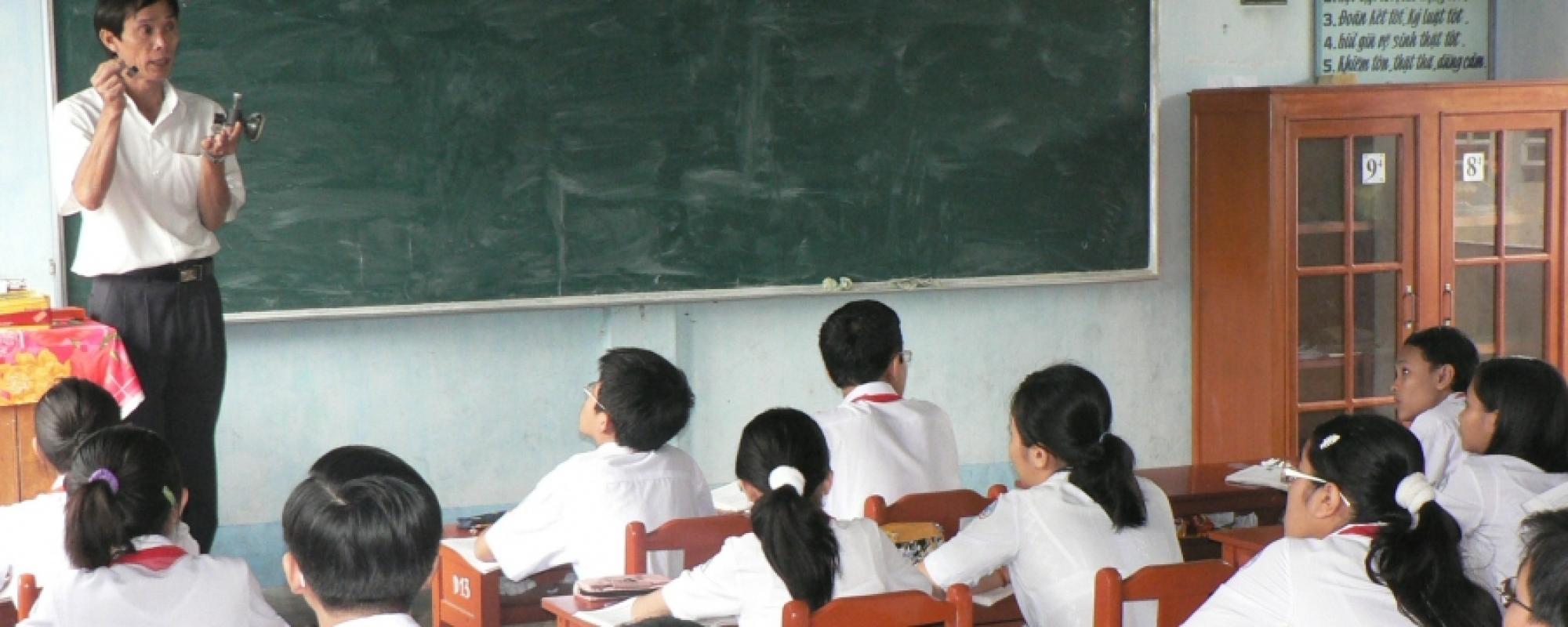 Classroom full of children looking at their teacher