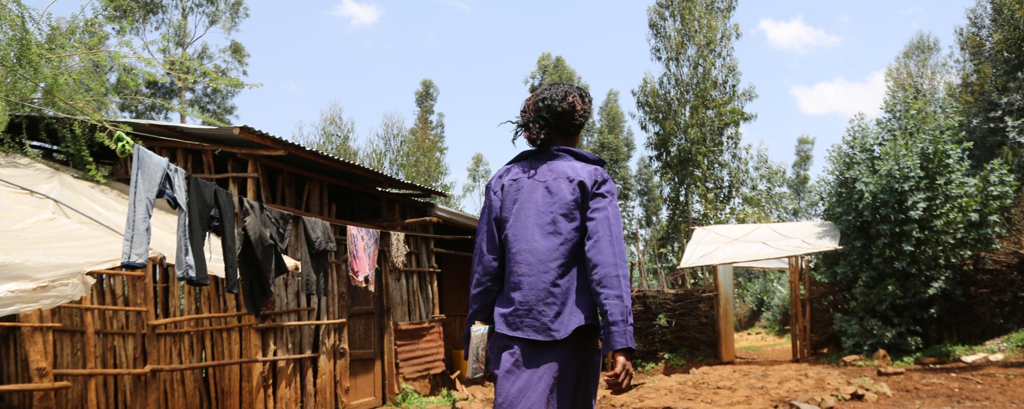 women in purple walking away 