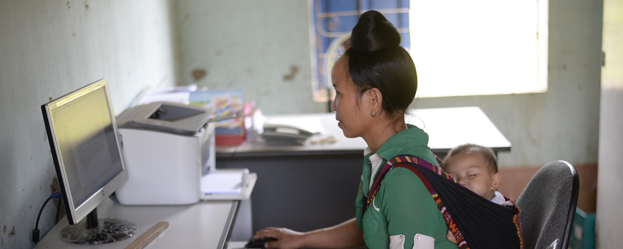 ,u, working with child in sling on her back