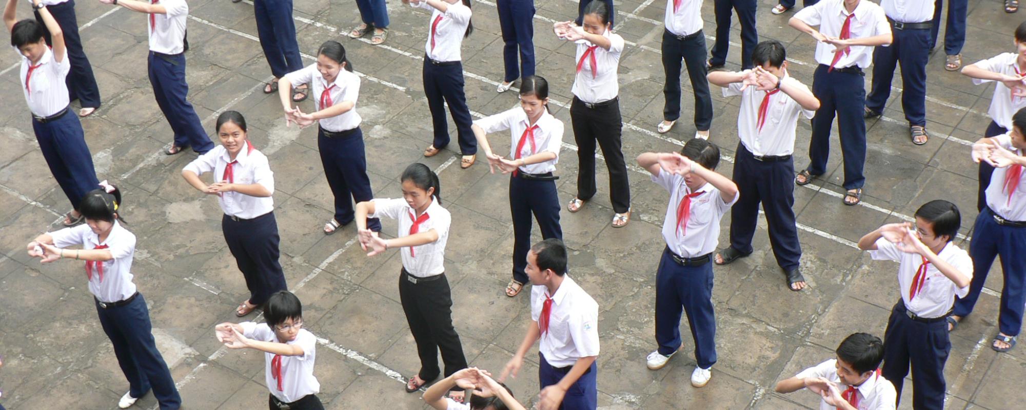 schoolyard of children stretching