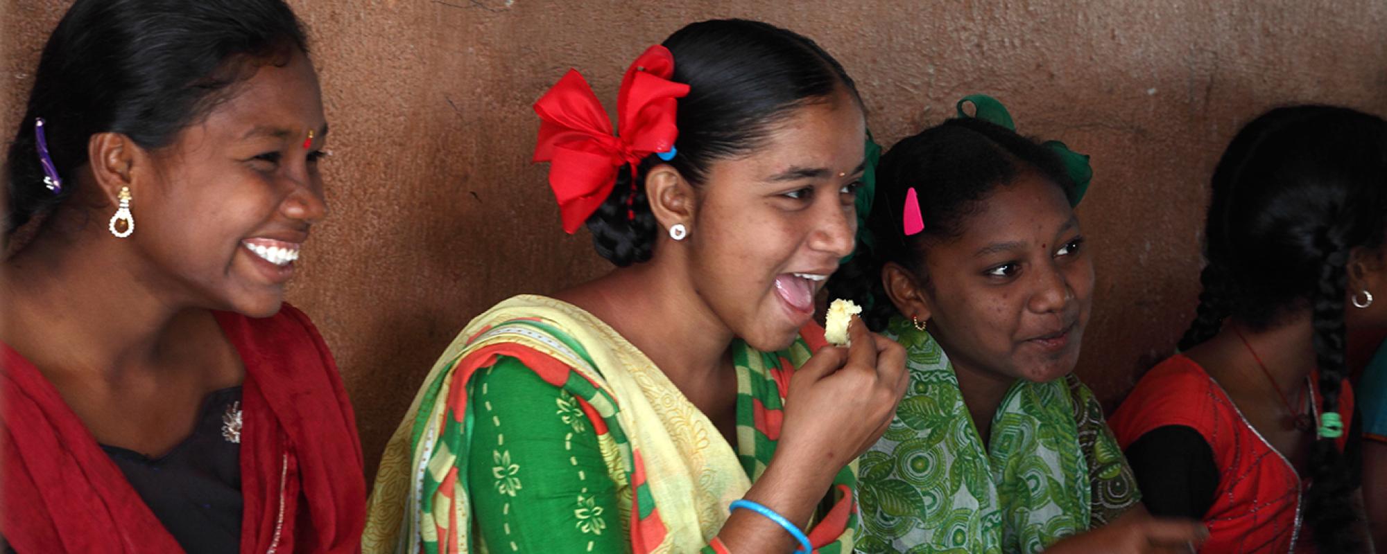 girls laughing and eating 