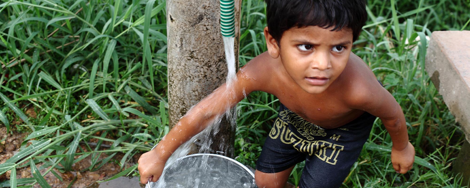 boy collecting water 