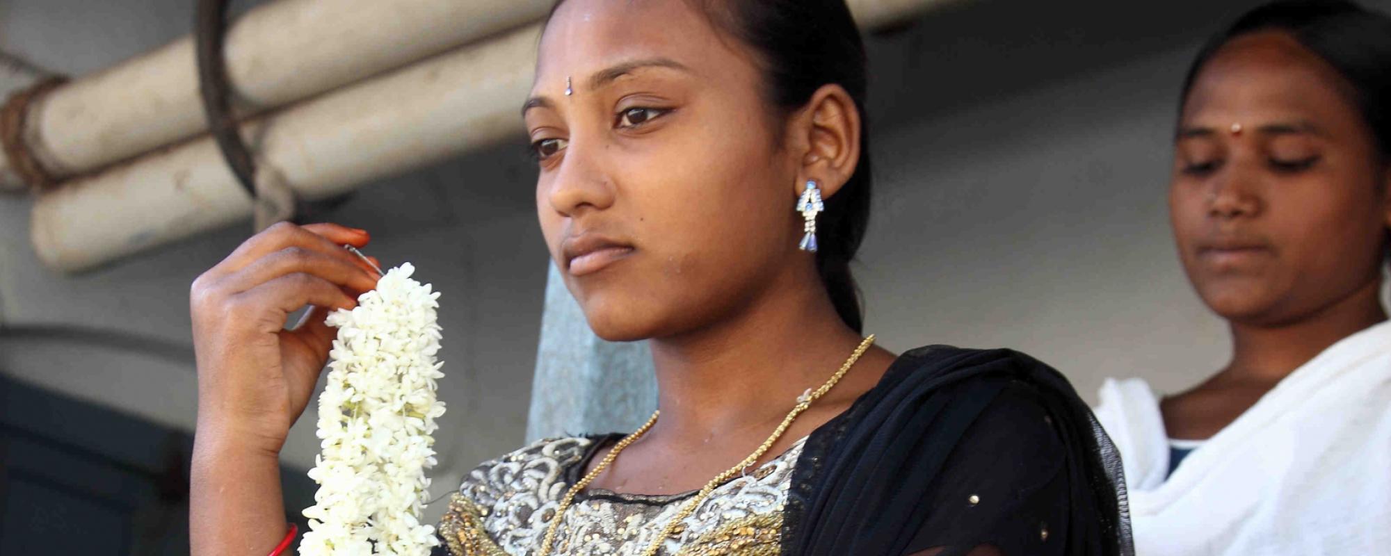 Women preparing for her wedding holding flowers