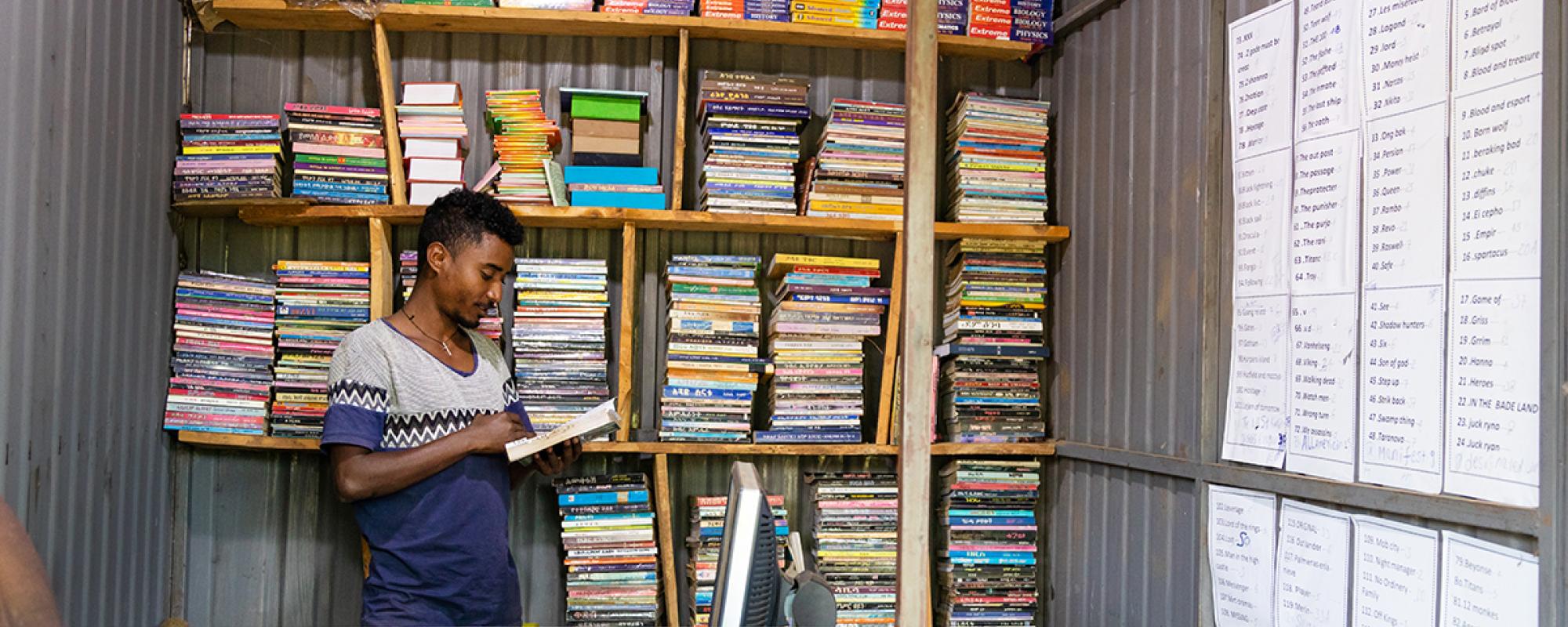 Man reading in book store 