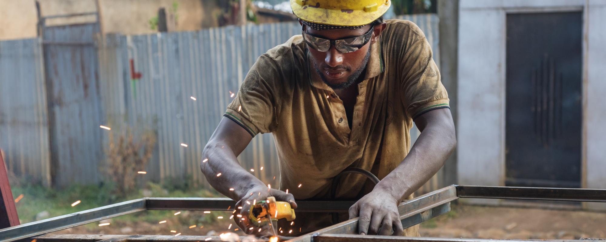 man welding