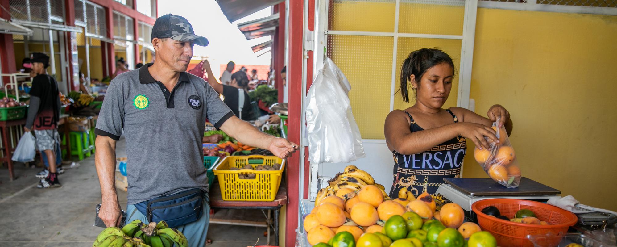 Lady selling fruit at a market