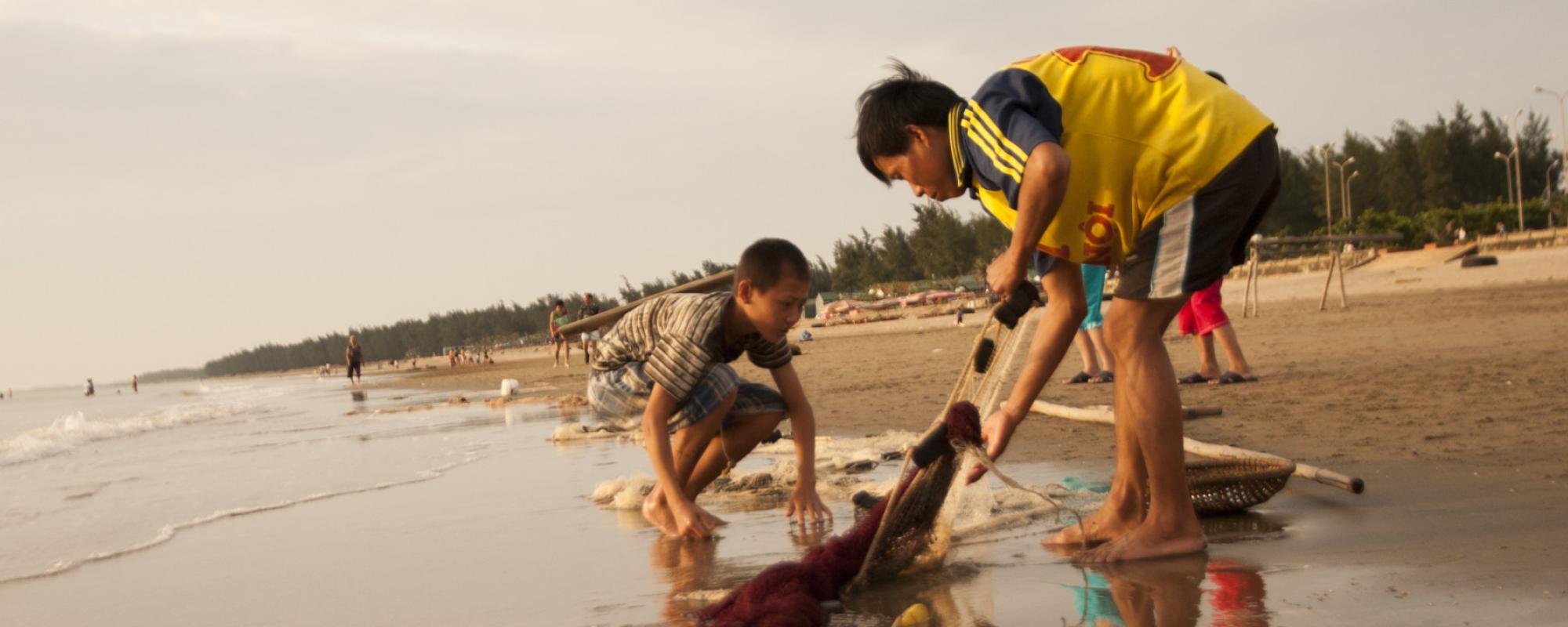 men working on the beach 