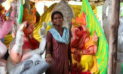 Women standing at a stall with stuffed animals