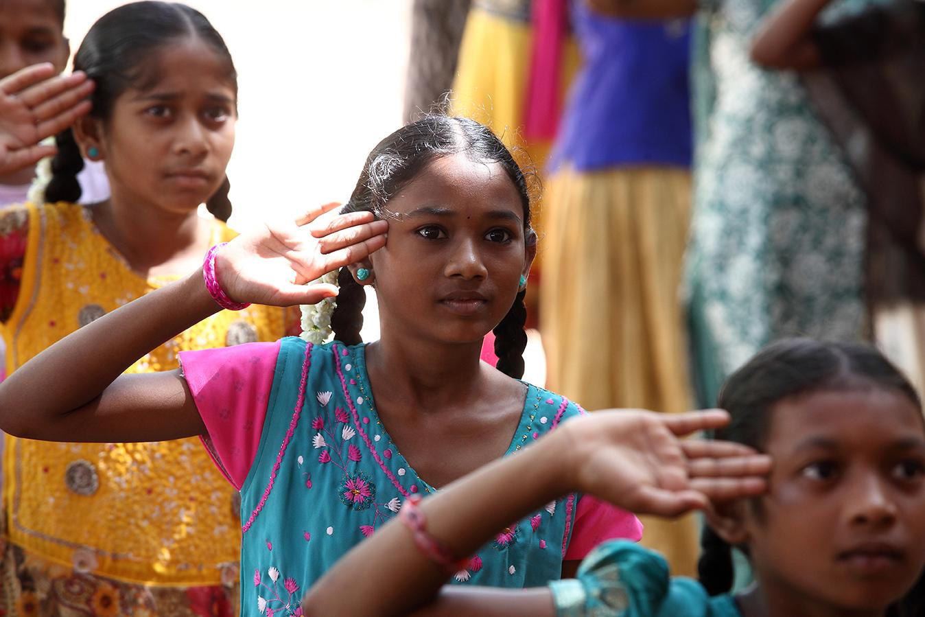 three girls saluting