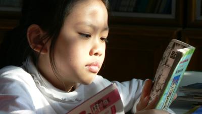 girl reading in the sun