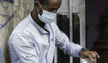 Ethiopian Man using sanitiser