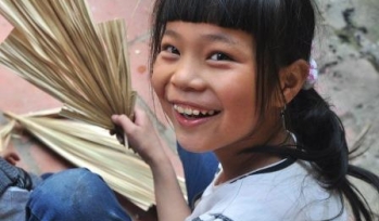 Laughing girl with a fan Laughing girl with a fan