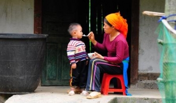 Mother feeding child