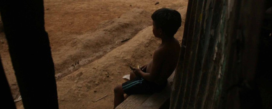 Child sat outside their house