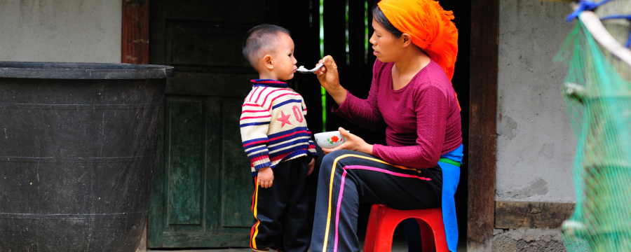 Mother feeding child