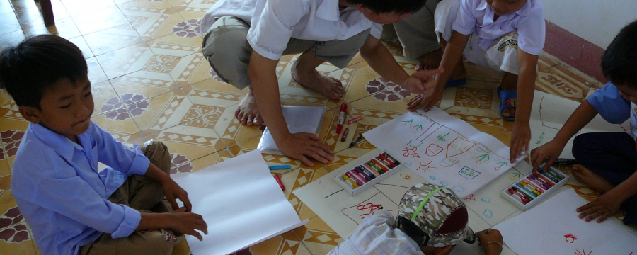 Children drawing on the floor