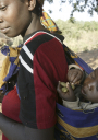 Woman carrying child on her back